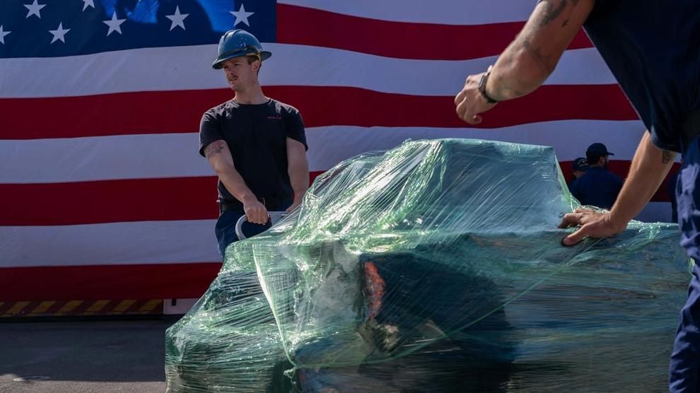 Boatswain’s Mate 2nd Class Carson Williams moves a pallet of seized cocaine aboard the Coast Guard cutter Kimball in San Diego on April 24, 2025