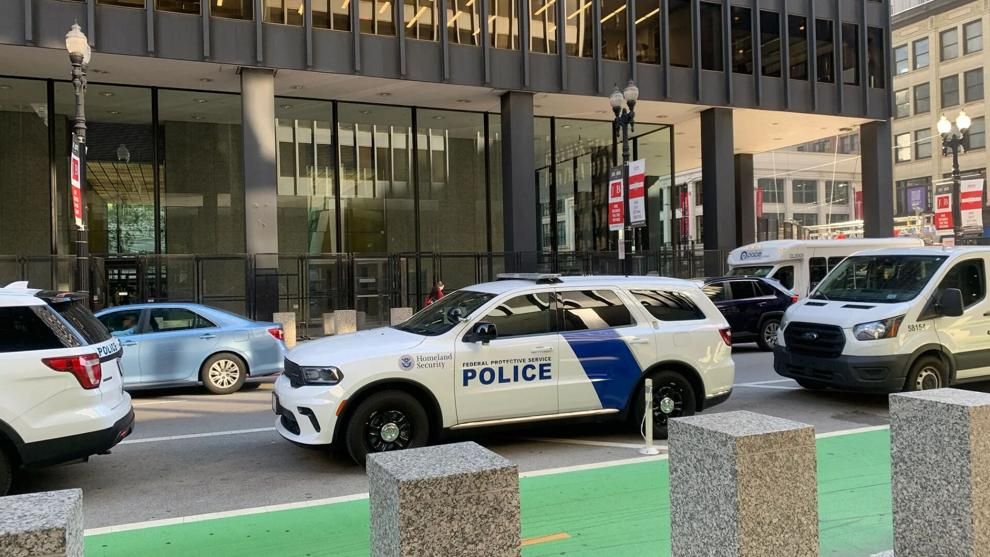 Federal Protective Service vehicles are parked outside the Everett McKinley Dirksen United States Courthouse