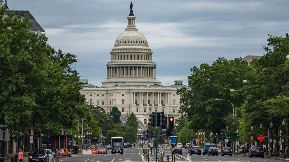 Traffic moves in front of the U.S. Capitol in Washington, D.C.