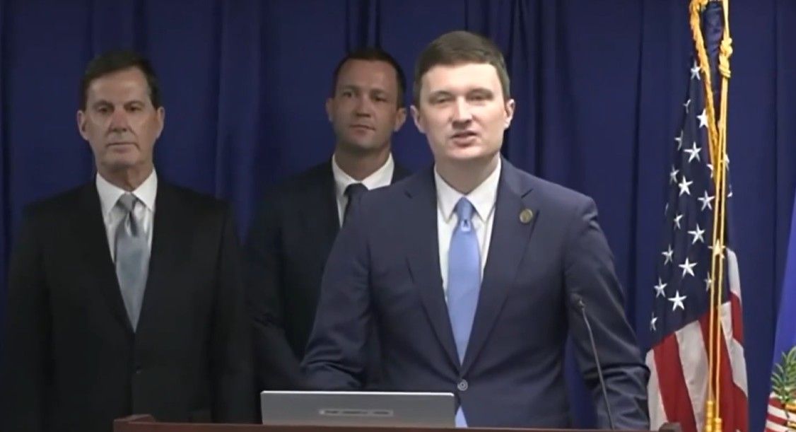 Acting Deputy Attorney General Trent McCotter announces charges against 28 Foreign Nationals in California for election crimes. -- Screenshot from @TheJusticeDept on X