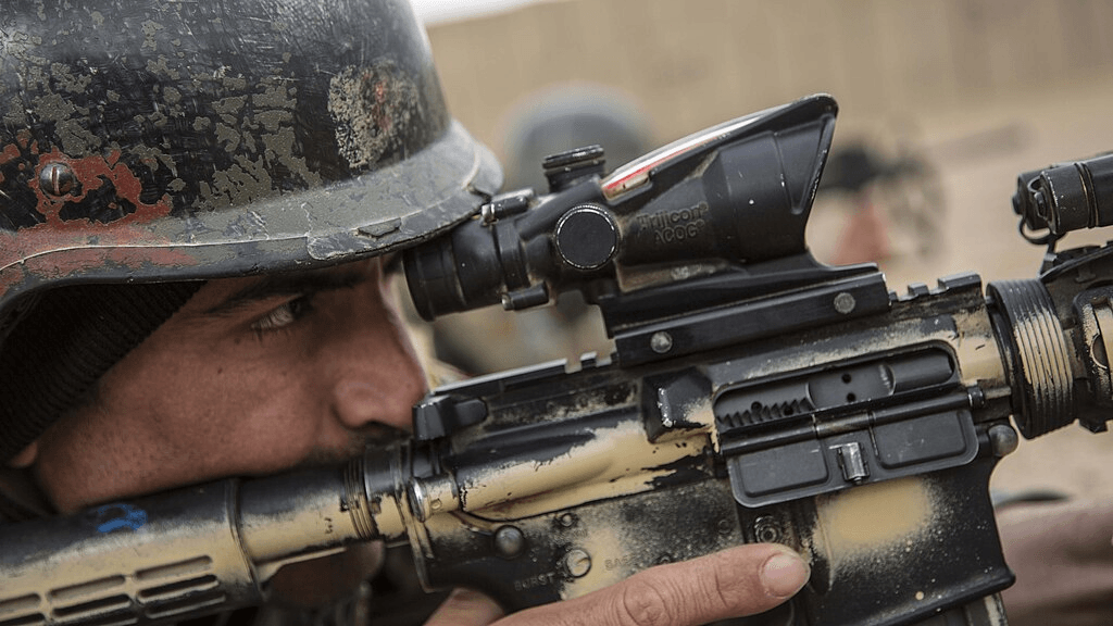 An Afghan commando fires his weapon during training. March 11, 2013
