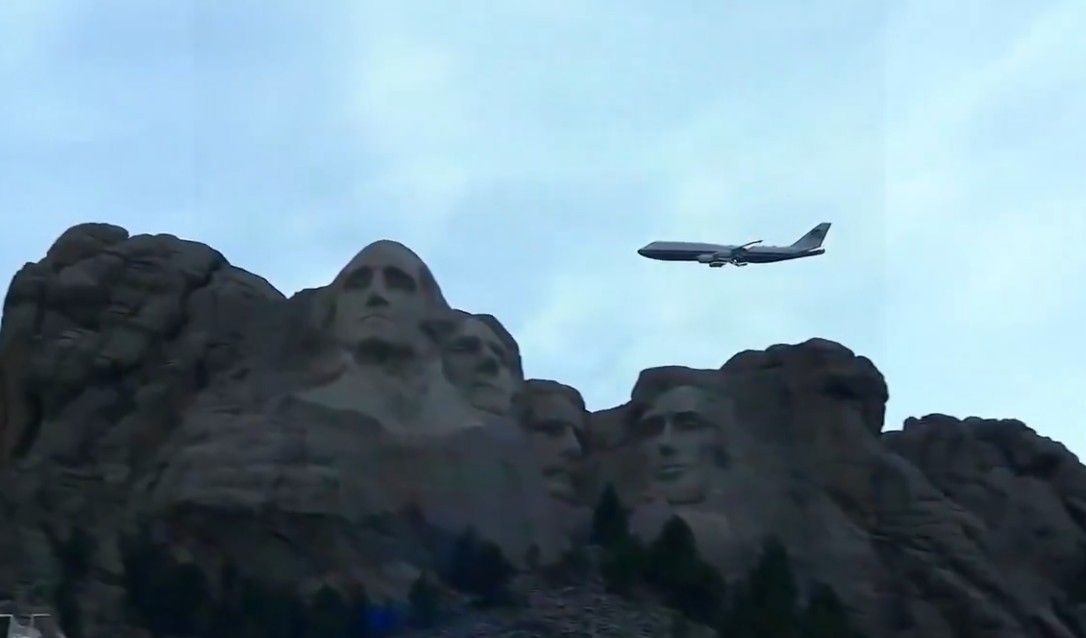 Air Force One does a flyby of Mt. Rushmore in an iconic image.