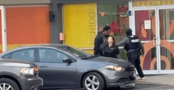 Ice officers detaining an illegal alien outside a preschool