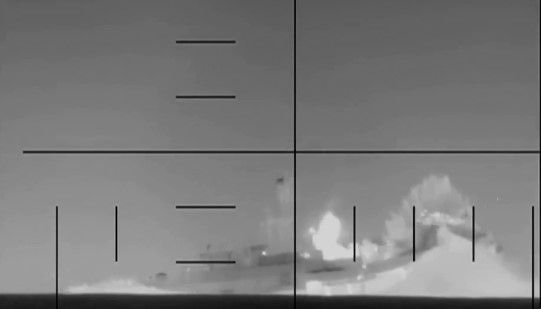 Iranian warship the Soleimani is seen exploding after a torpedo hit in a video released by the Department of War.