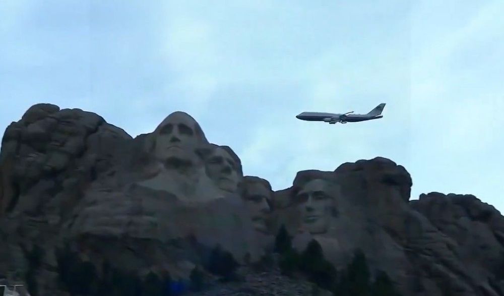 Air Force One does a flyby of Mt. Rushmore in an iconic image.