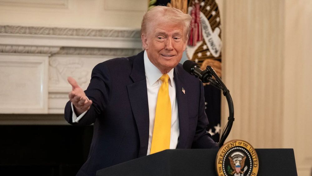 President Trump standing at the White House Podium