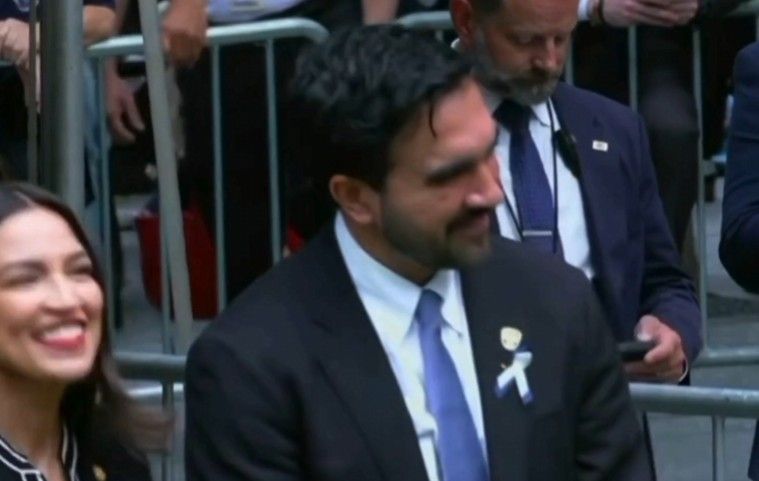 Mamdani and AOC caught laughing on Camera as victims names were read. -- Image: Screenshot from the @Newsforce X page