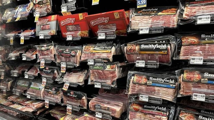 Packages of bacon are displayed for sale at Lowes Foods in Winterville, N.C