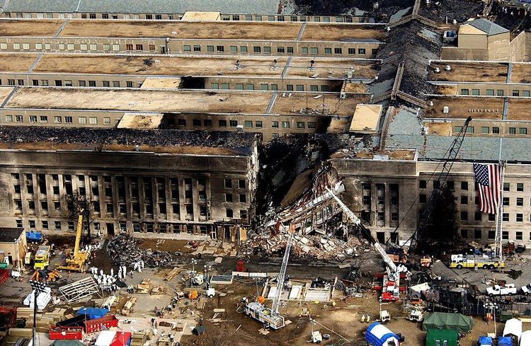 Aerial view of the Pentagon showing emergency crews responding to the destruction caused when a hijacked jetliner crashed into the building, during the 9/11 terrorists attacks. -- Image: TSGT CEDRIC H. RUDISILL, USAF