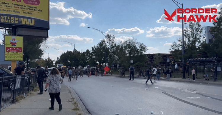 ICE agents in riot gear protecting a crime scene as crowds move closer