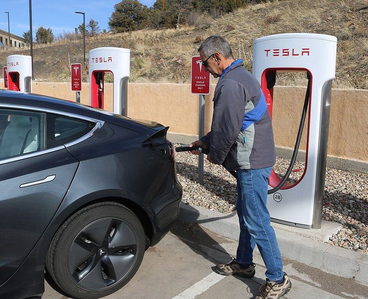 A Tesla owner charging his vehicle.