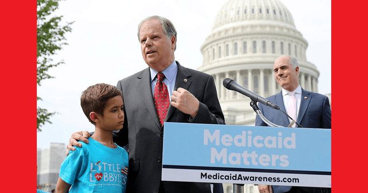 Doug Jones speaking at pro-Medicaid press conference.
