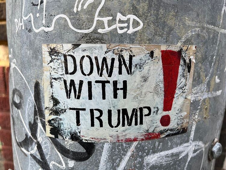 A sign in Washington DC reading "Down With Trump!"