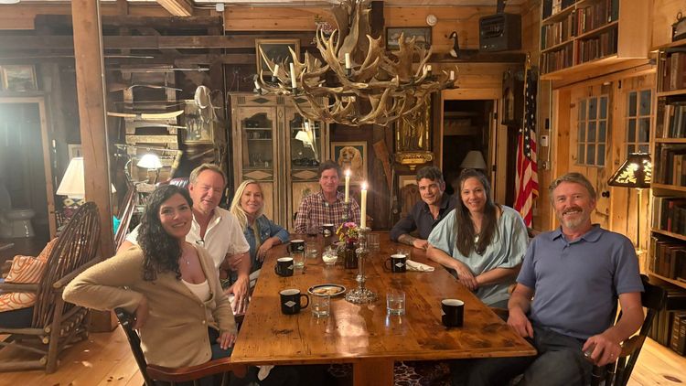 Photograph posted on X by Marjorie Taylor Greene showing herself seated at a table with Carlson, Massie, former National Counterterrorism Center Director Joe Kent, and several others, including Greene’s husband, conservative journalist Brian Glenn.