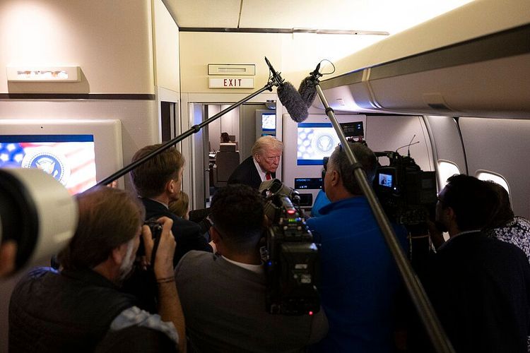 President Trump speaks to the press aboard Air Force One.