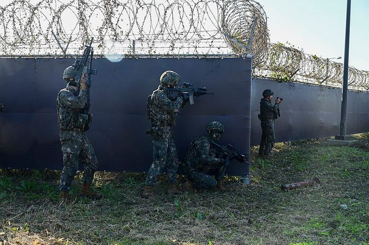 Airmen from the Republic of Korea air force’s 38th Military Police Squadron defend the base from opposition forces during a joint exercise at Kunsan Air Base, Republic of Korea, Oct. 17, 2025.