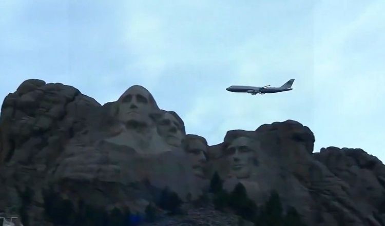 Air Force One does a flyby of Mt. Rushmore in an iconic image.