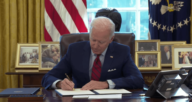 Biden signing an executive order 
