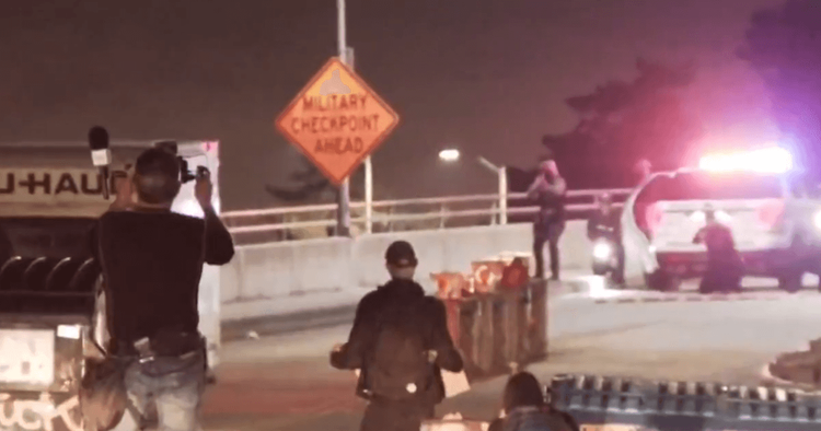 Coast Guard security pointing their weapons just seconds before the truck accelerated backward at them,