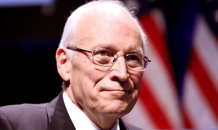 Dick Cheney closeup with American flags in the background