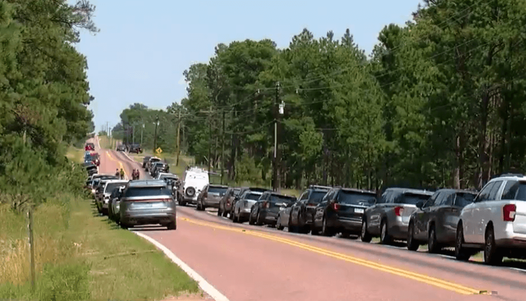 Lawe Enforcment vehicles Line a Road