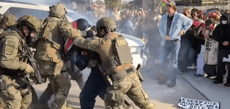 ICE officers arrest a protestor in Chicago