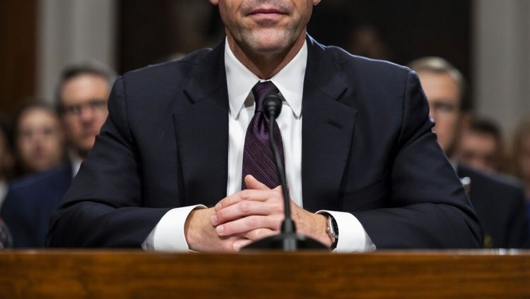 AI Generated Image of a man sitting at a hearing room table from the neck down.