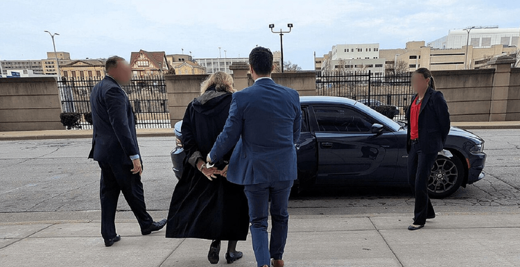 FBI agents arresting Wisconsin Circuit Court Judge Hannah Dugan in April, 2025