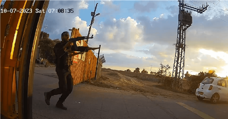 Armed Hamas gunmen storming the gate of Kibbutz Alumim October 7 2023
