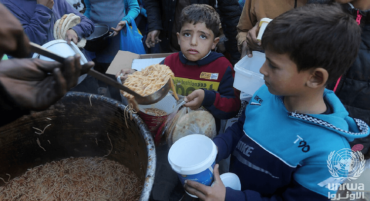 Palestinians receive food aid in March, 2025