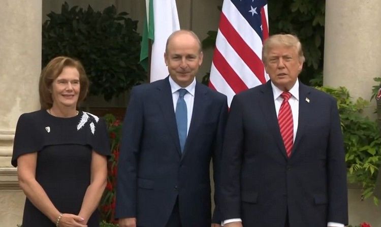 President Trump poses for a photo with Taoiseach Micheál Martin and his wife, Mary, as he arrives at Farmleigh House in Dublin. -- Image: Screenshot from the @RapidResponse47 X page