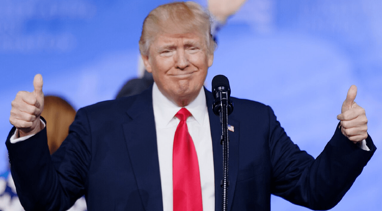 President Trump smiling with two thumbs up