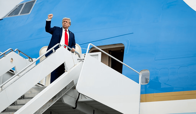 President Donald Trump boards Air Force One at Joint Base Elmendorf Richardson in Anchorage, Alaska.
