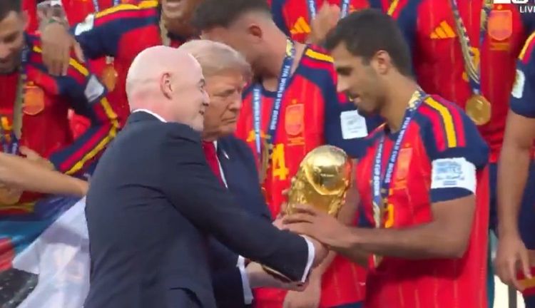 President Trump and FIFA President Gianni Infantino present the trophy to Spain’s captain Rodri.