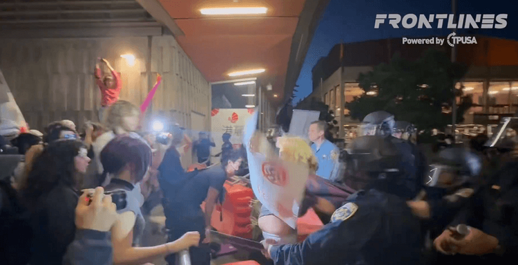 Protestors clash with police outside the TPUSA event at UC Berkeley