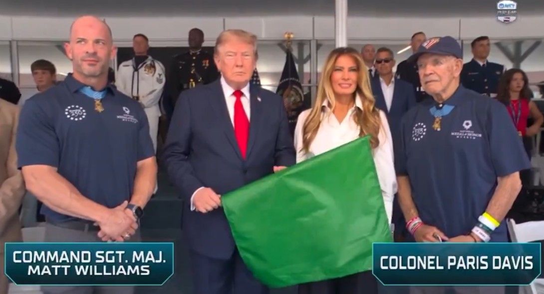 President Trump is given the green flag in preparation for starting the Freedom 250 race.
